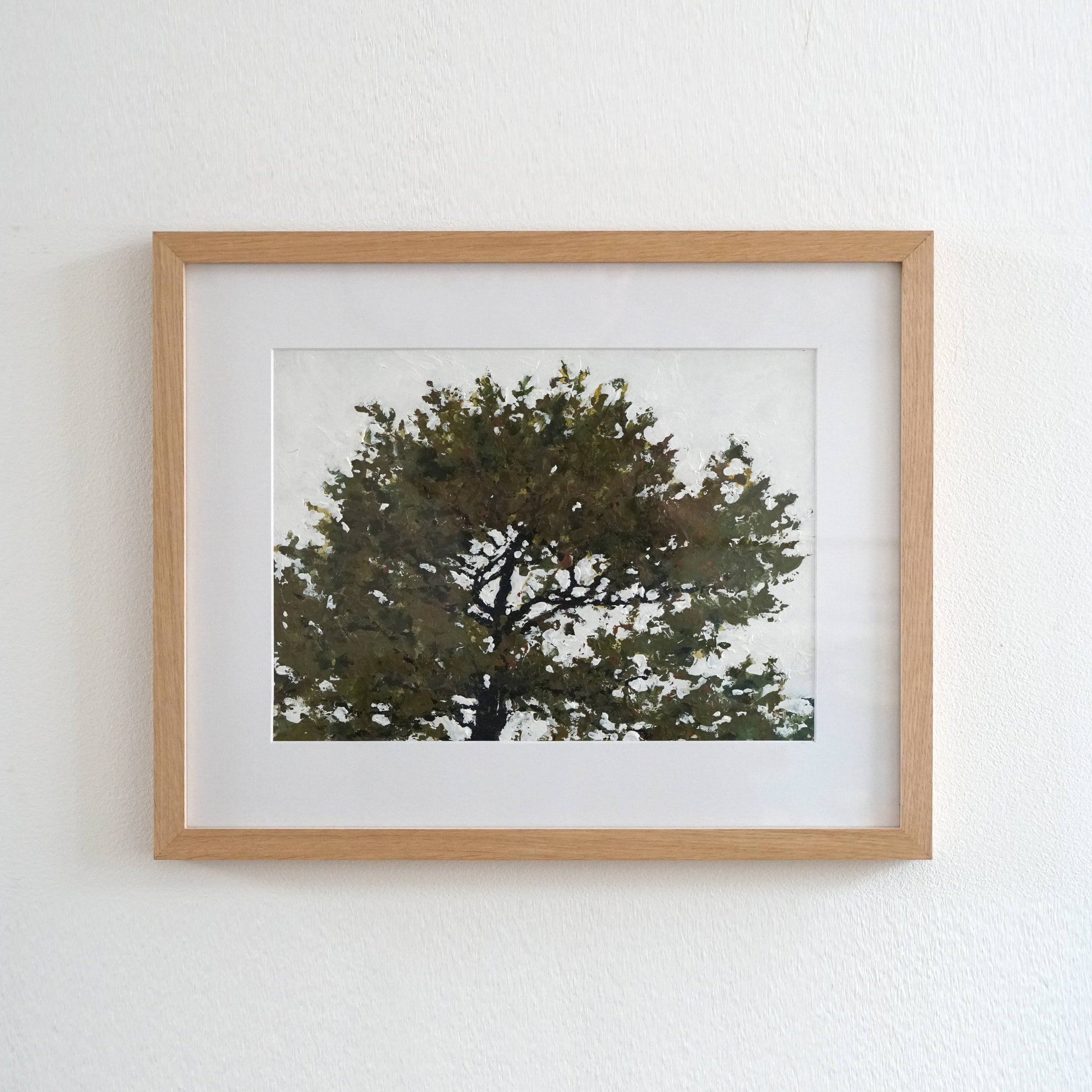 Oil painting of a tree in an oak frame