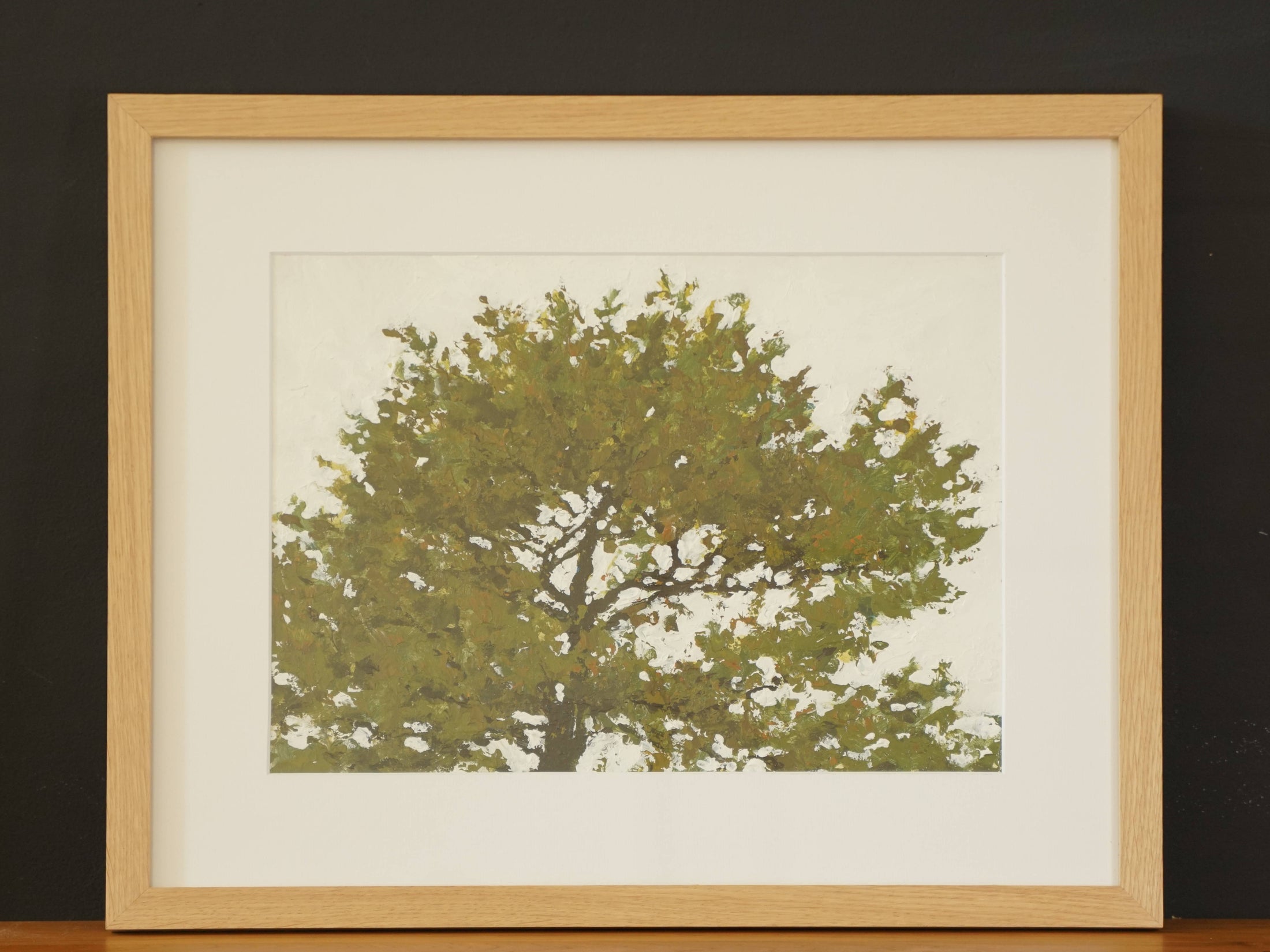 Oil painting of a tree in an oak frame